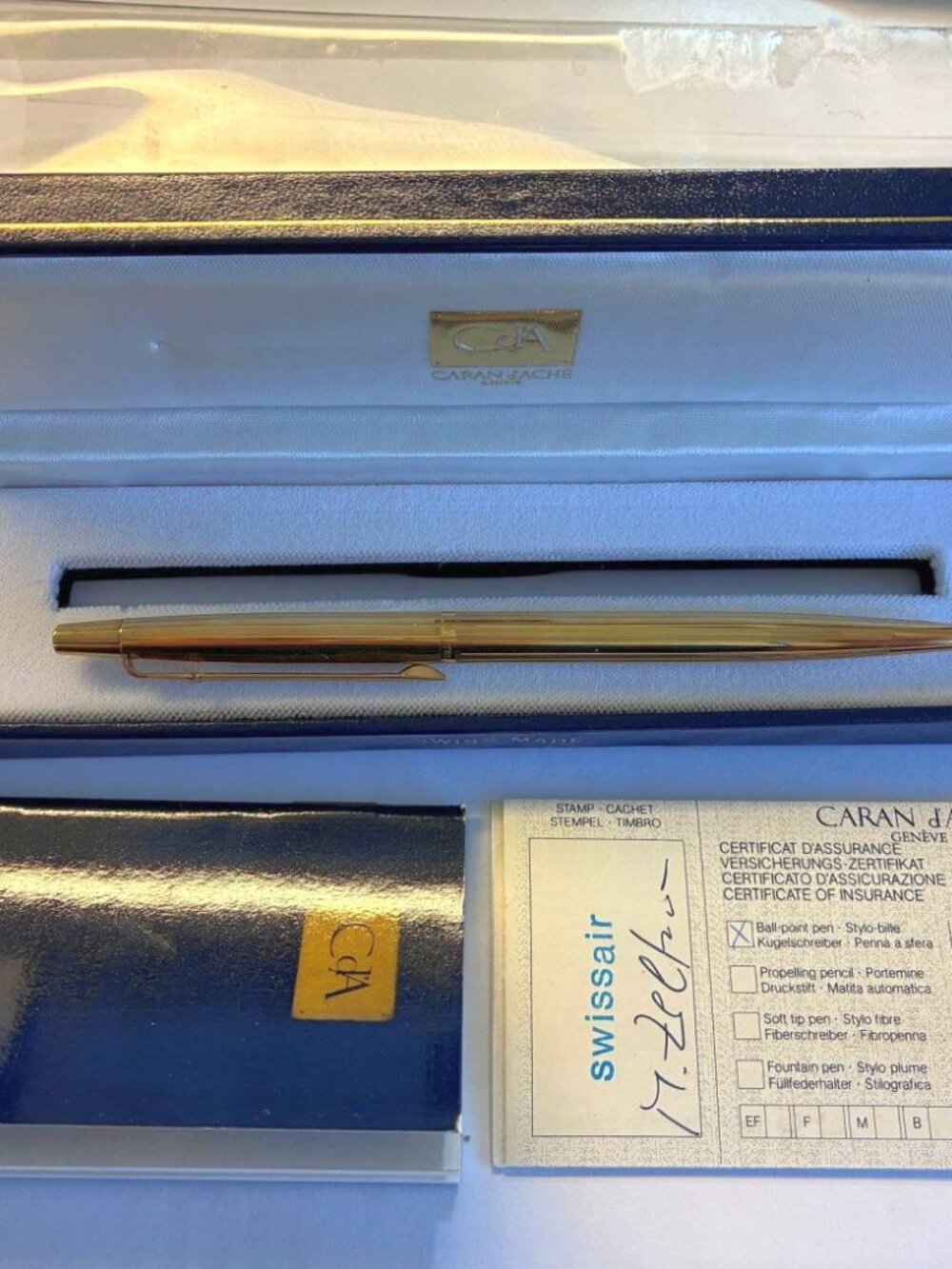 CARAN D'ACHE GOLD BALLPOINT PEN FROM MID 1980s WITH PAPERS AND BOX